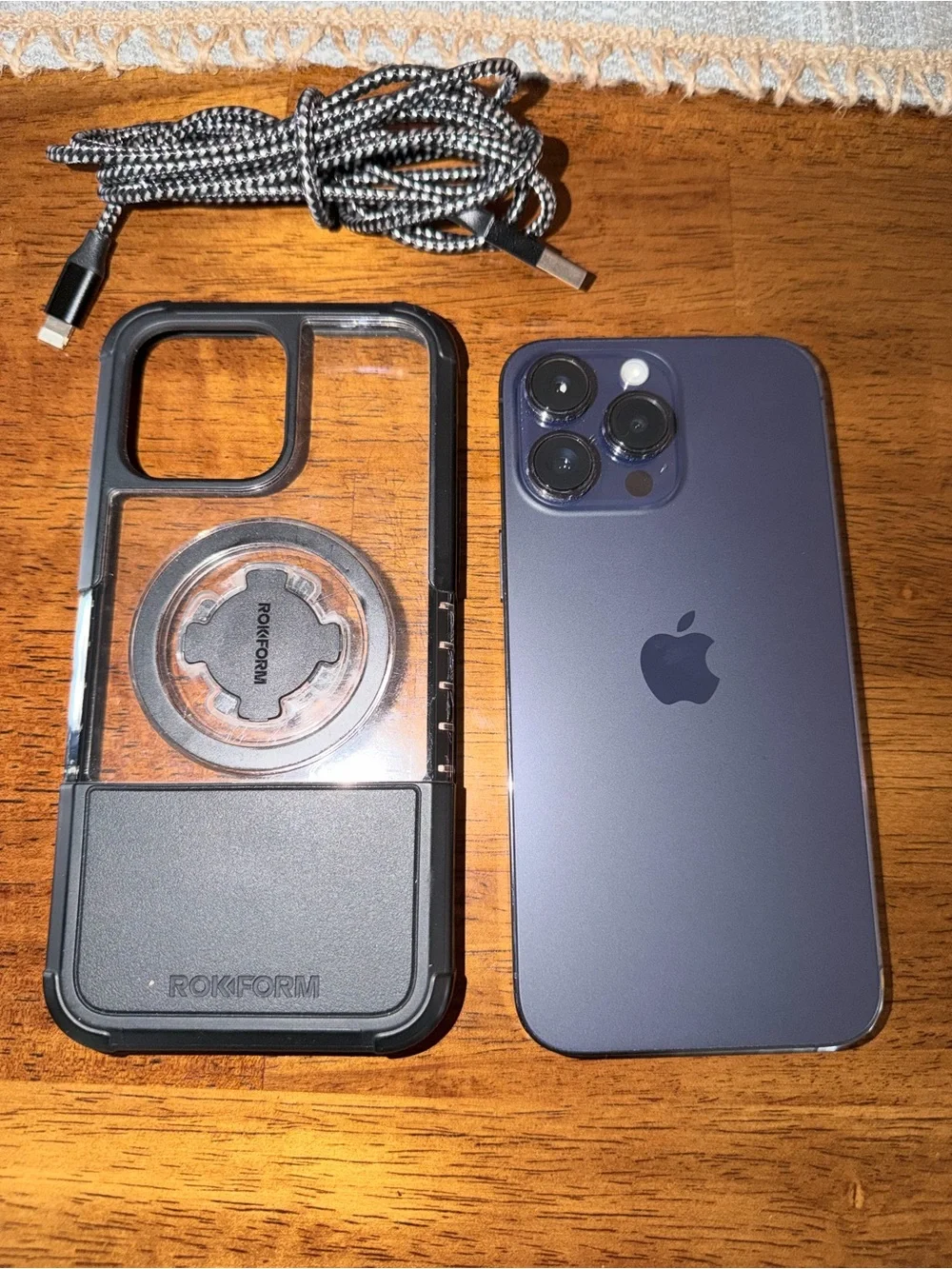 Apple iPhone with Clear-Back Case and Black Braided Cable